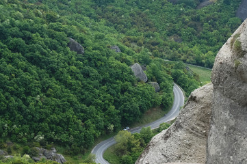 Landscape of asphalting road from peak of mountains.