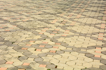 Fototapeta premium patterned paving tiles, old cement brick floor background
