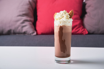 Cold chocolate milkshake frappe in glass