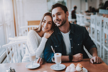 Young Couple is Resting in Cafe