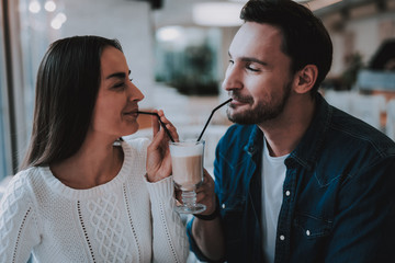 Young Couple is Resting in Cafe
