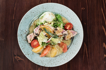 fruit salad stands on a wooden table