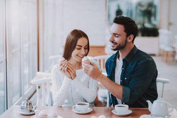 Young Couple is Resting in Cafe