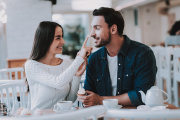 Young Couple is Resting in Cafe
