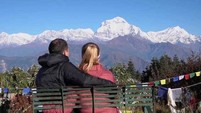 Romantic Couple Enjoying the View of the Himalayas. Two Young People Hike Together in Nepal. Active Tourism in the Mountains