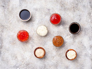 Obraz na płótnie Canvas Ketchup, mayonnaise, mustard, horseradish, soy sauce and tartar