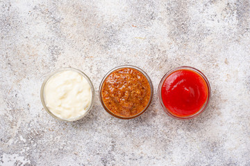 Obraz na płótnie Canvas Set of different sauces: mustard, ketchup, mayonnaise