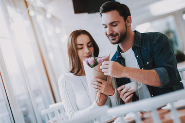Young Couple is Resting in Cafe