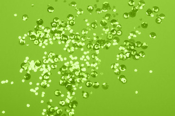 Festive background with confetti pastel green color.