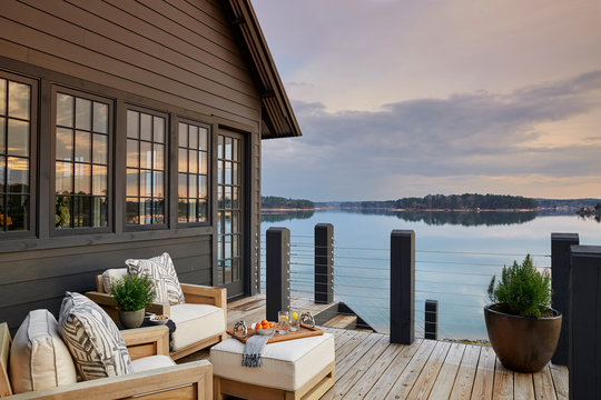 Wooden house with terrace over lake