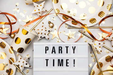 Party time lightbox celebration message with luxury gold party decorations