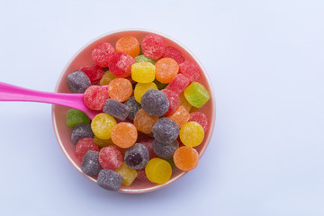 whale with colored jelly beans - jujubas in Portuguese - and white background top view