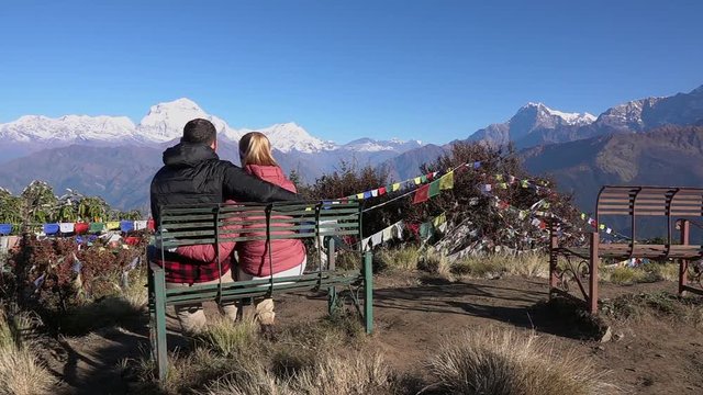Romantic Couple Enjoying the View of the Himalayas. Two Young People Hike Together in Nepal. Active Tourism in the Mountains