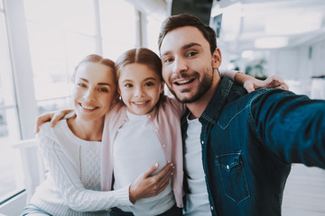 Young Family is Doing Selfie in Cafe