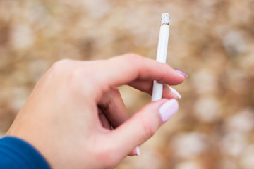 Young woman enjoying a cigarette