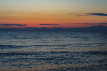 Morning sunrise on the horizon of Aegean sea.
