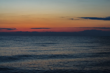 Morning sunrise on the horizon of Aegean sea.