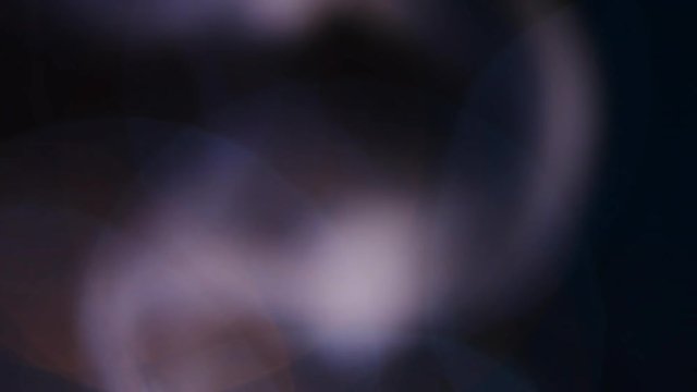 Smoke and fire alarm light in bokeh, abstract low key background