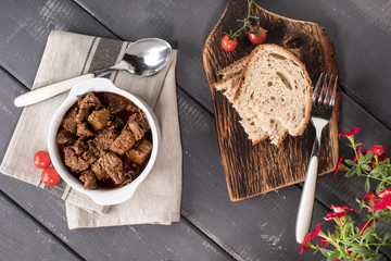 Beef meat stew in ceramic pot.