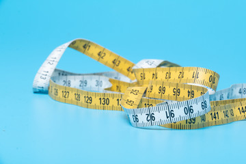 Yellow and white measure tape