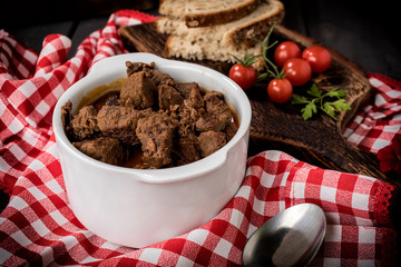 Beef meat stew in ceramic pot.