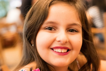 Fototapeta premium close-up on face of child girl smiling