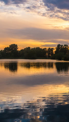 Fototapeta na wymiar Smartphone HD Wallpaper of beautiful sunset with reflections near Plattling - Isar - Bavaria - Germany