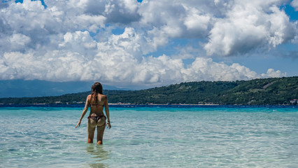 Obraz premium Young woman in sexy swim wear enjoying the beach