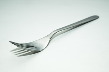 One fork on a white background