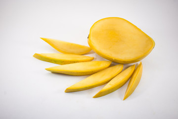Yellow mango and mango slices isolated white background