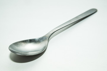 One spoon on white background