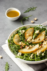 Arugula, gorgonzola cheese, caramelized pear and nut salad. Healthy food. Light breakfast, lunch or dinner. 