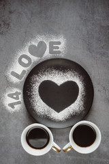 Valentines day.Two  cup of coffee and heart on dark background. Winter or spring concept