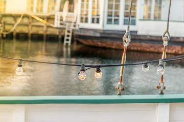 Obraz premium Details of wooden boat and light bulbs line. Copenhagen, details