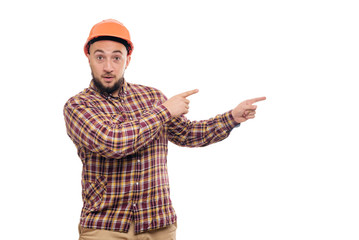 Builder worker in protective construction orange helmet hands pointing to the right, isolated on white background. Copy space for text. Time to work. 