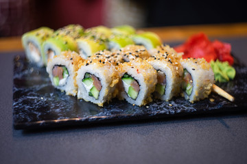 Japanese rolls on dark table