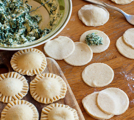 Making ravioli with ricotta cheese and spinach