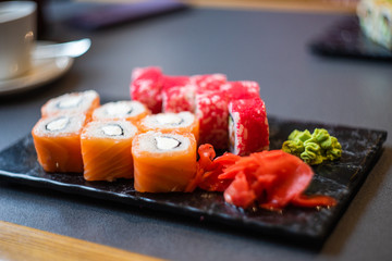 Japanese rolls on dark table