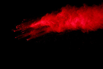 Fototapeta na wymiar Abstract Red powder splatted background,Freeze motion of red powder exploding/throwing green dust.