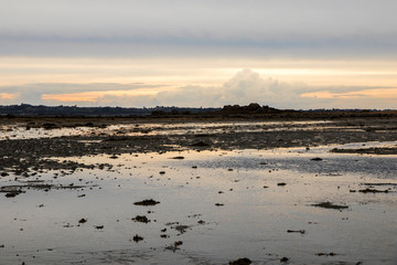Carantec, France. Views of the Bahie de Morlaix (Morlaix Bay) and the city of Saint-Pol-de-Leon at sunset, Brittany (Bretagne)
