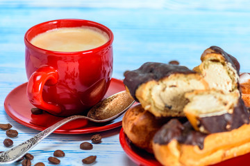 Coffee, waffles and custard cake on a light wooden background. 