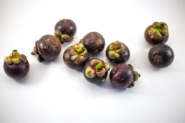 Isolated mangosteens. Plenty fruits isolated on white background top view