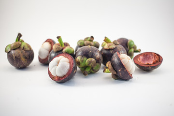 Isolated mangosteens. Plenty fruits isolated on white background top view