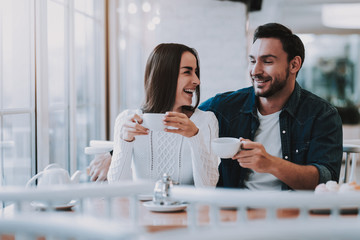 Young Couple is Resting in Cafe