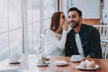 Young Couple is Resting in Cafe