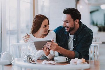 Young Couple is Resting in Cafe