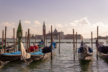 Venice, gondola on the background of the city