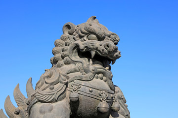 Fototapeta na wymiar giant lion sculptures under blue sky, tangshan city, China