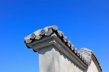 gray walls under blue sky