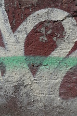sprayed signs on red grunge wall
